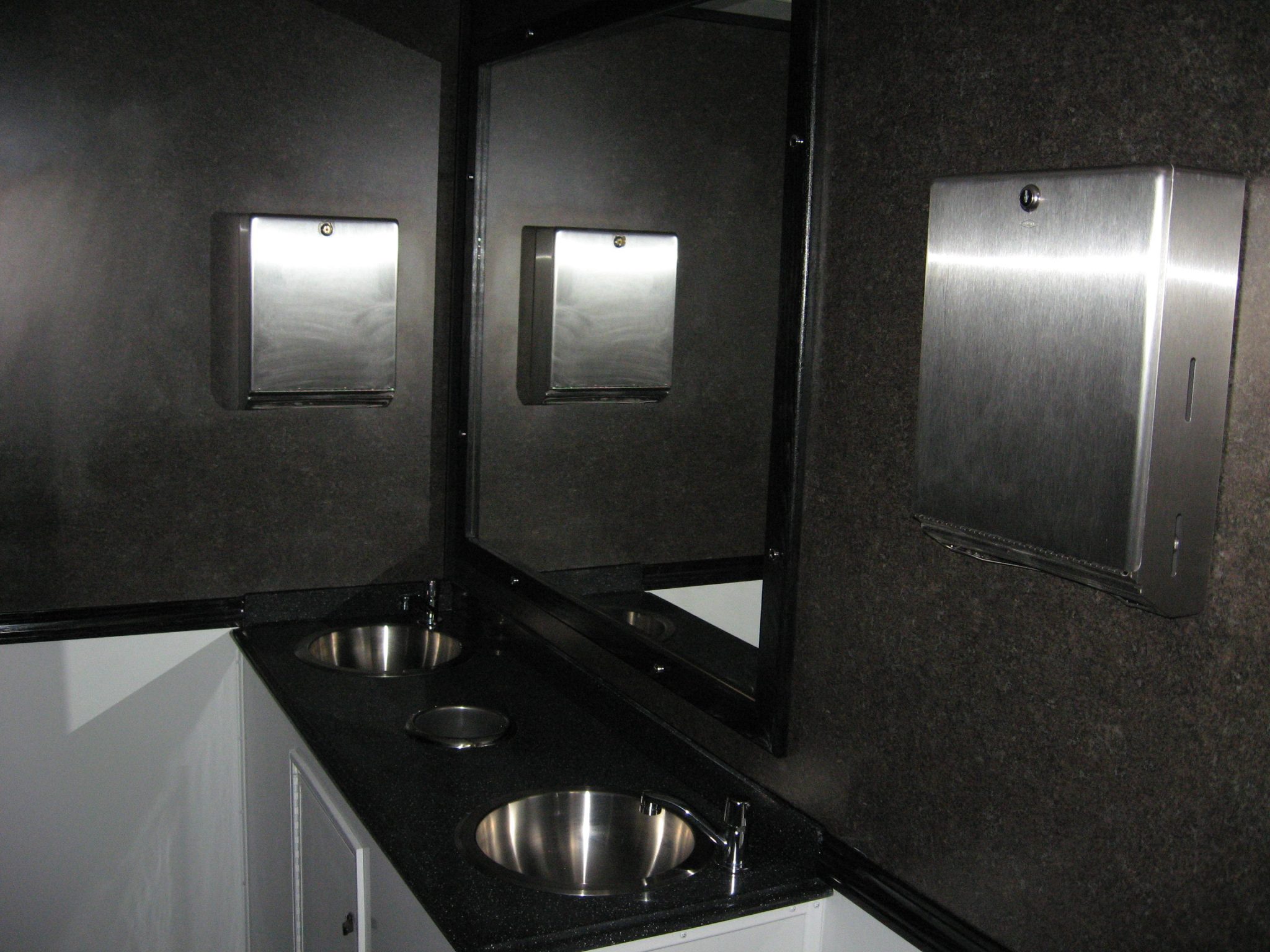 Double sinks provide ample room for cleaning up after using the facilities.