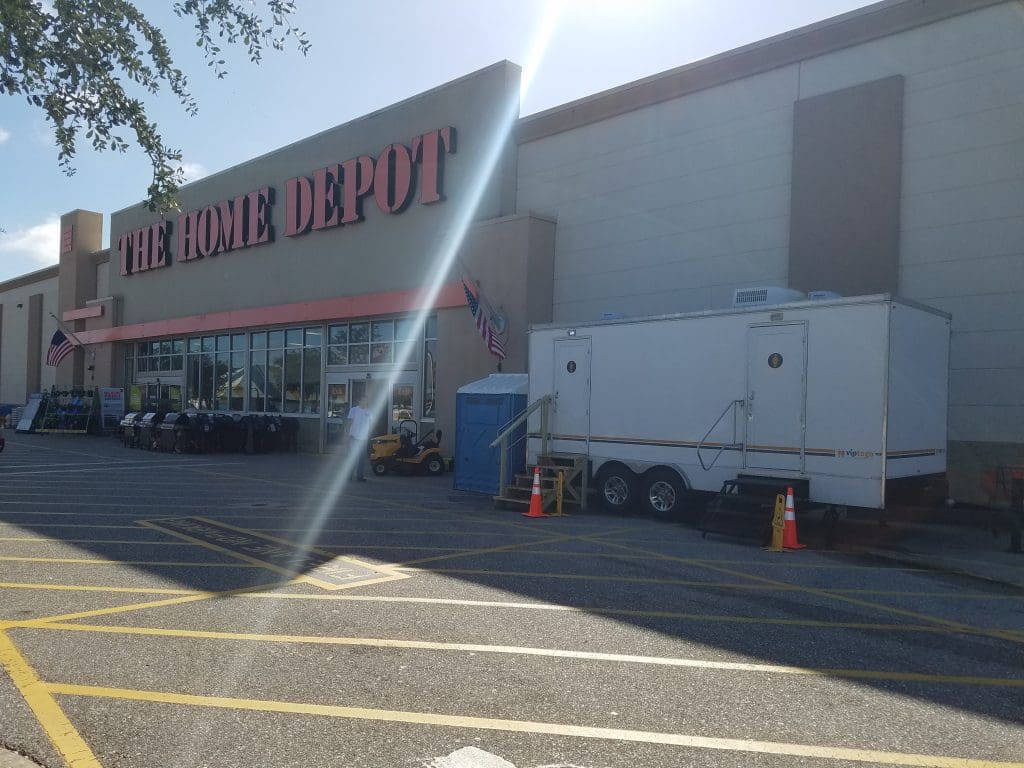 Restroom trailer outside a Home Depot during a store remodel