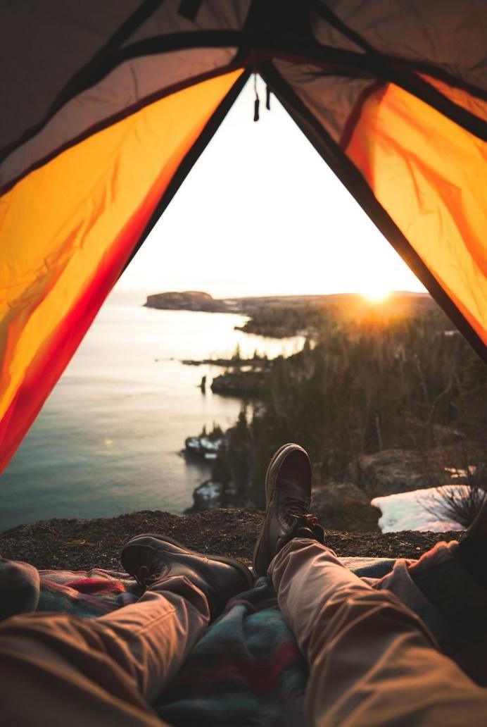 camping in tent on lake