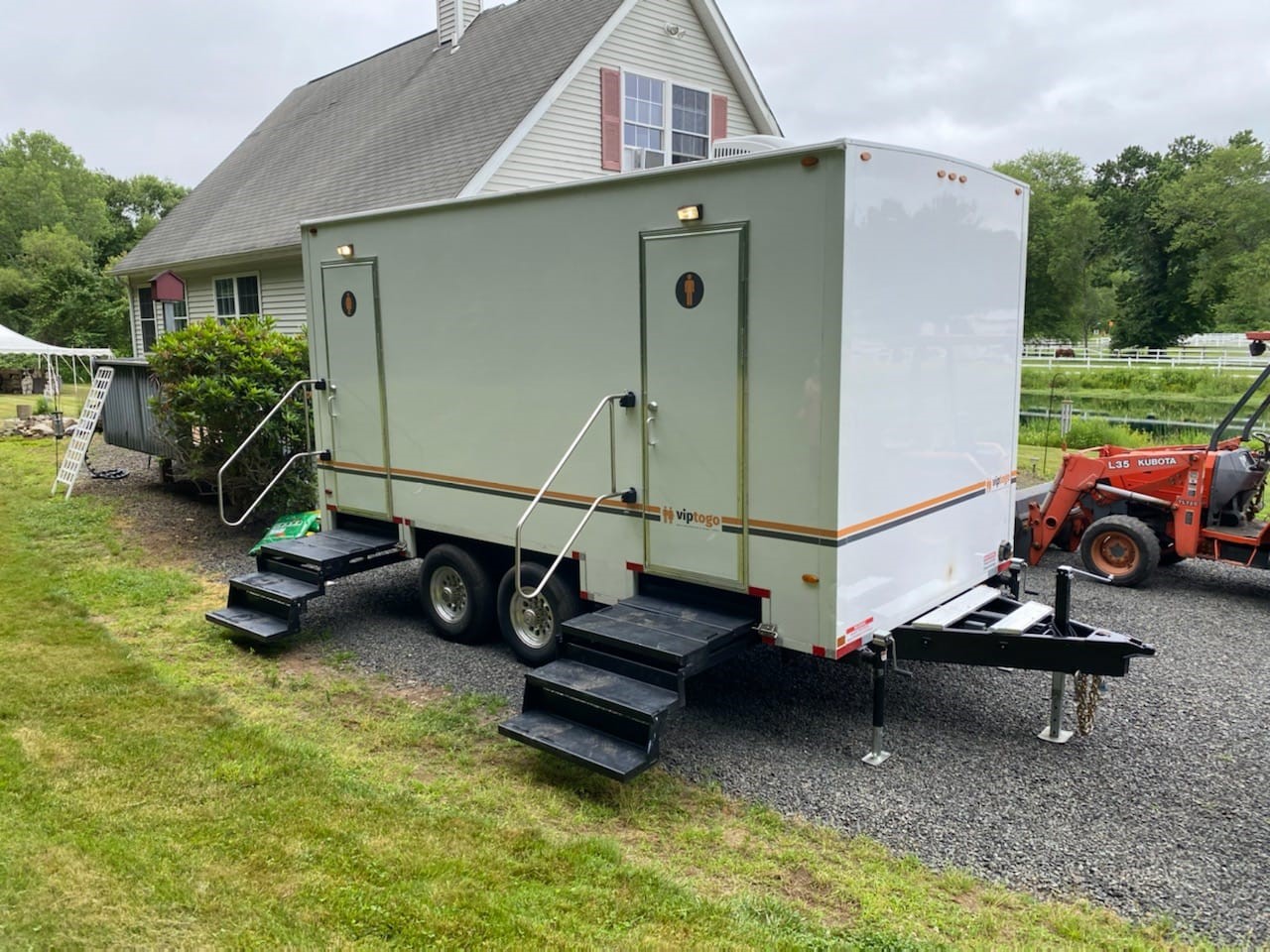 bathroom trailer rental on driveway