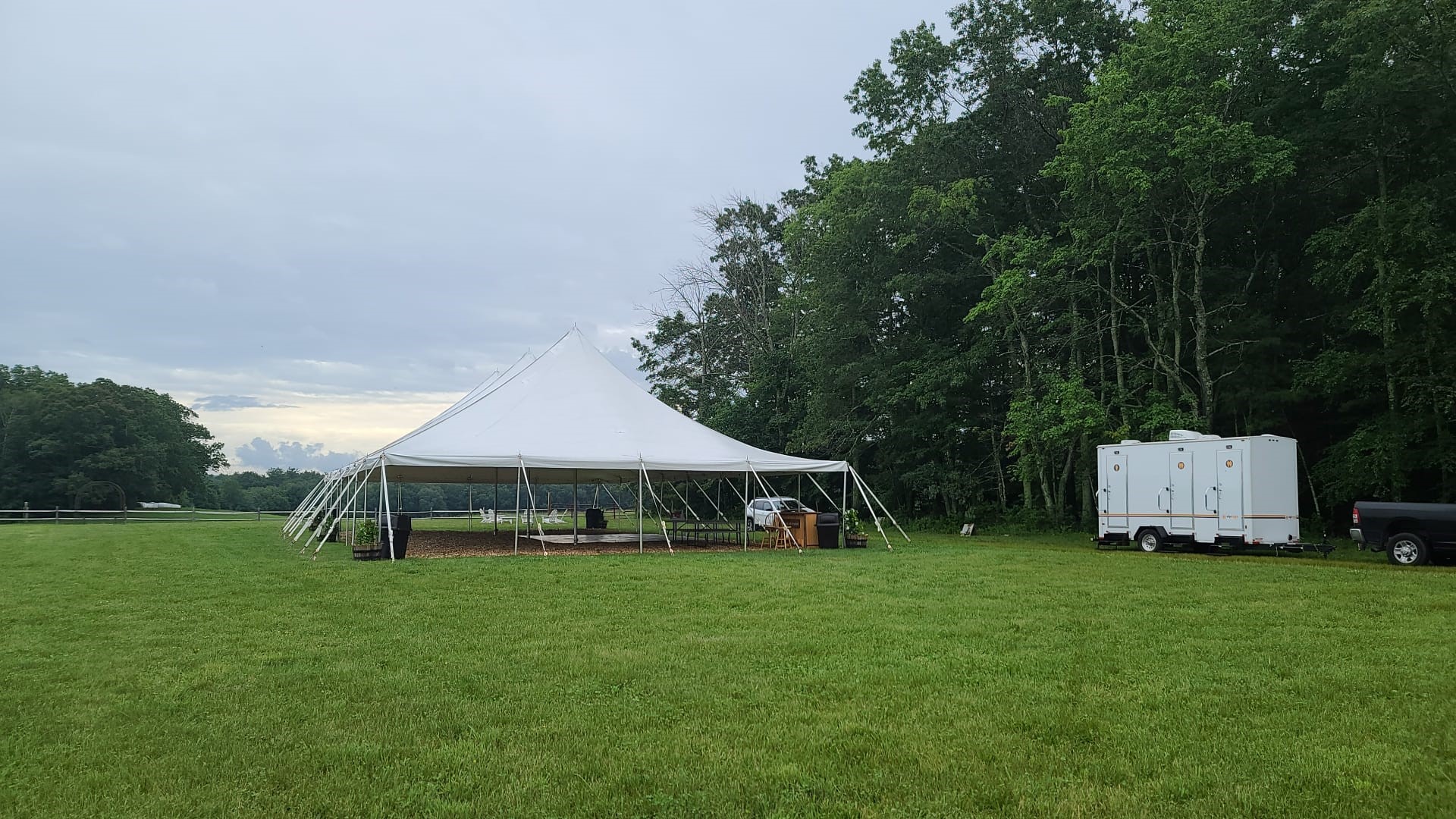 outdoor bathroom trailer near tent