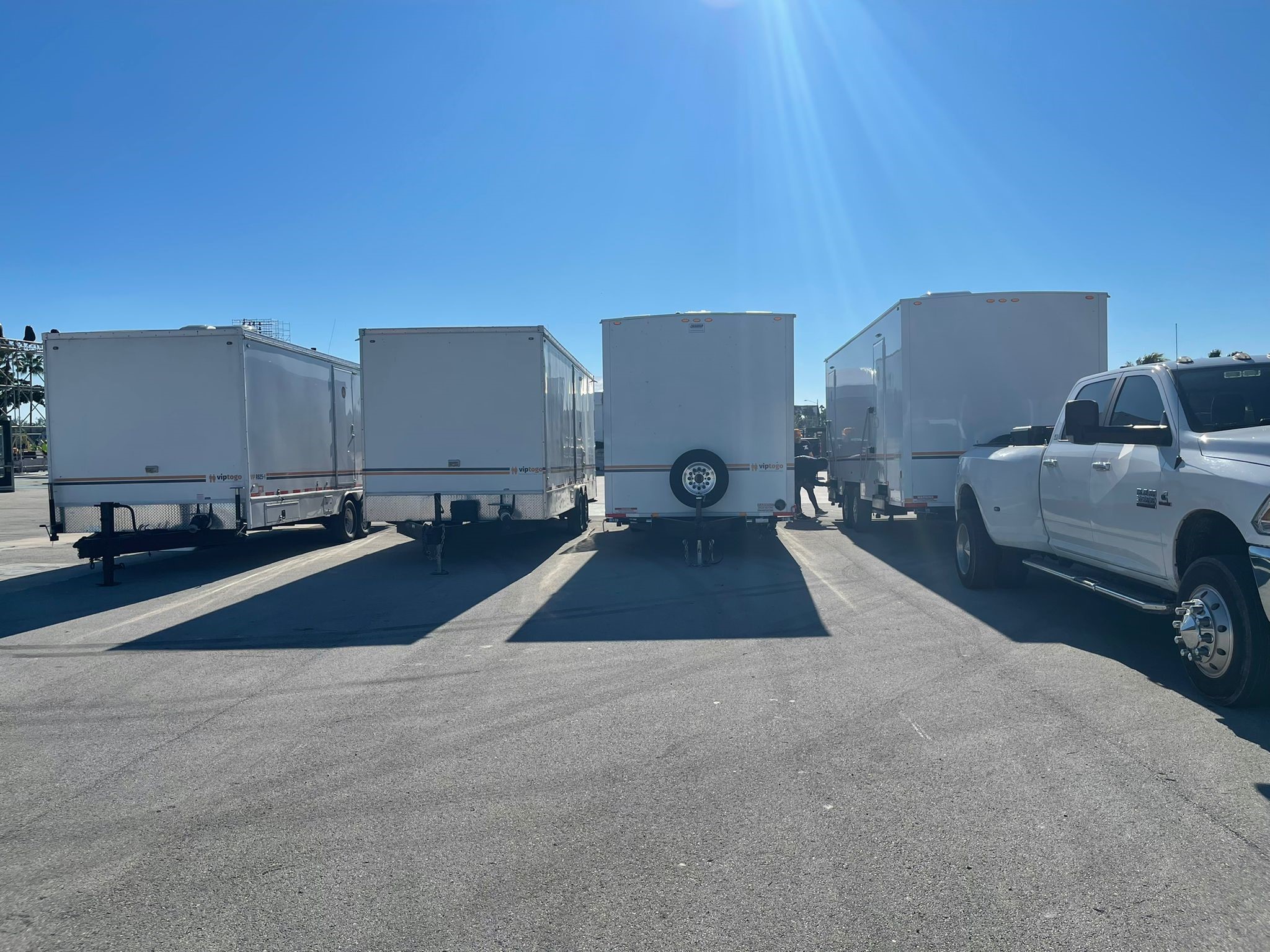 row of portable restroom trailers for rent
