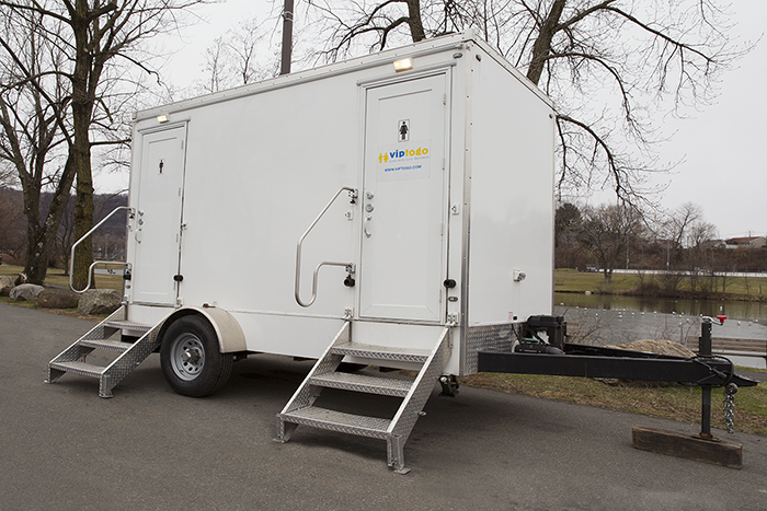 portable restroom trailer rental in park