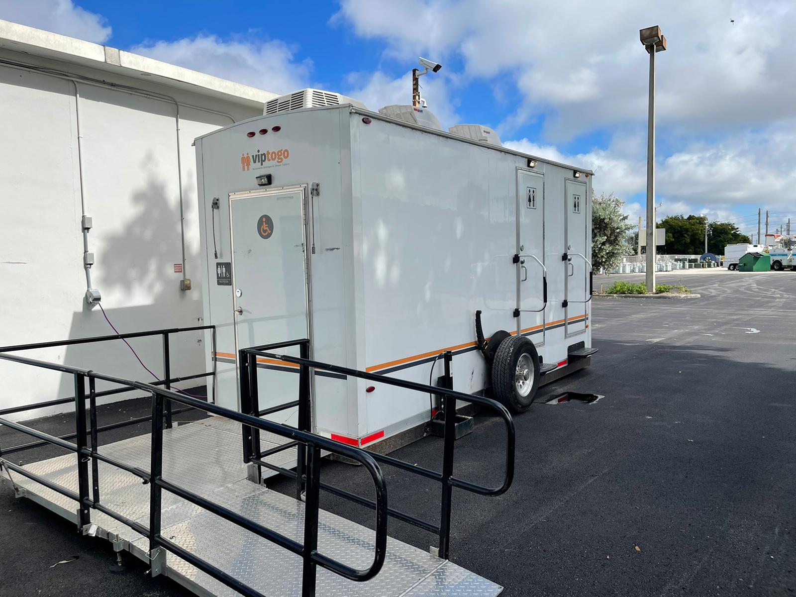 VIP handicapped restroom trailer that meets ada ramp handrail requirements