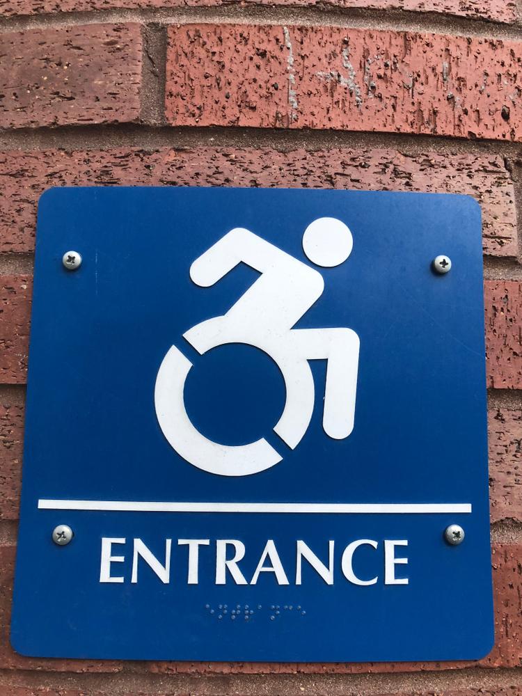 blue handicapped exit entrance sign motion