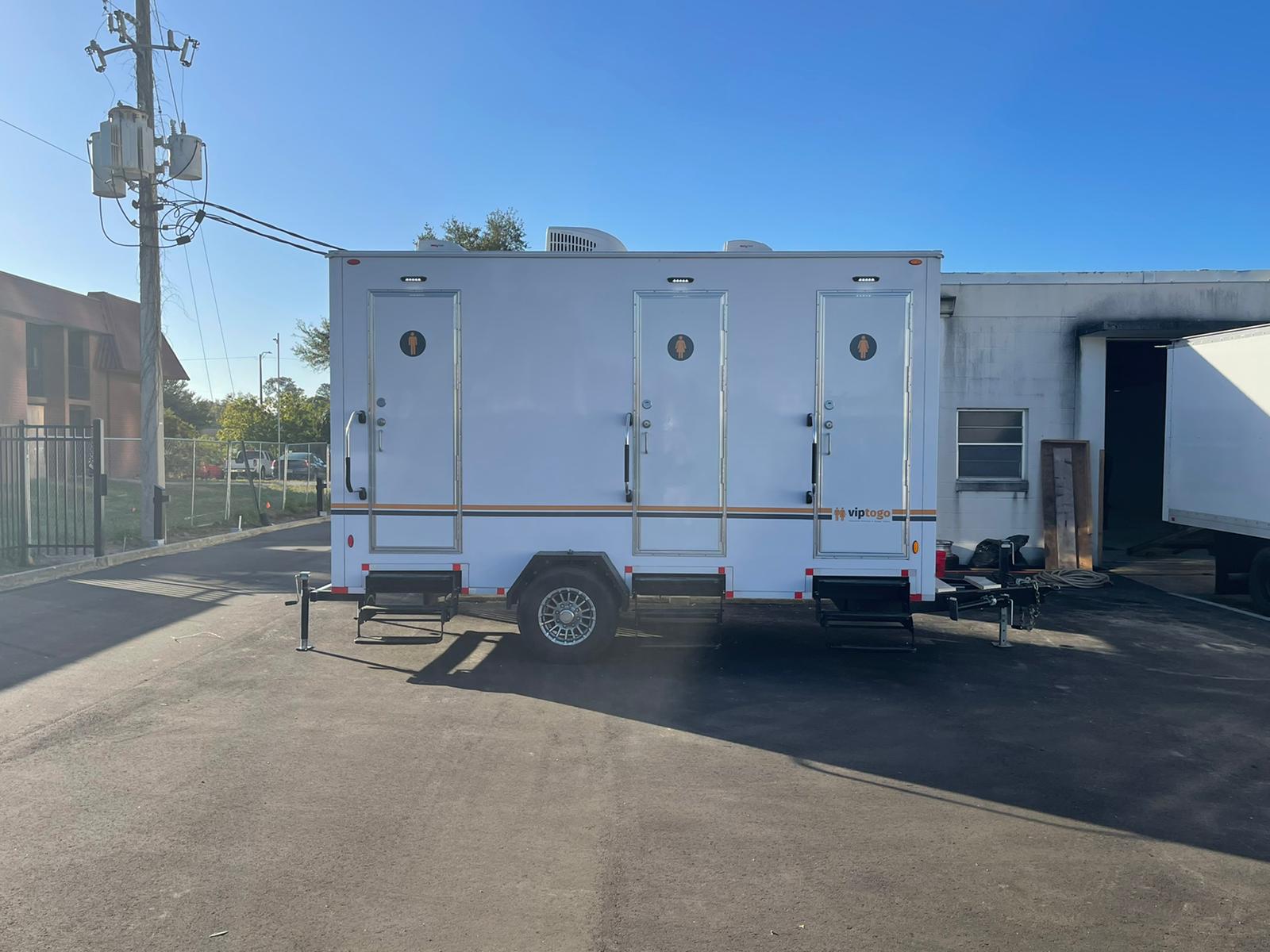 restroom trailer rental in parking lot