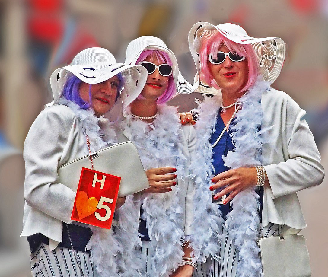 three women dressed up at event