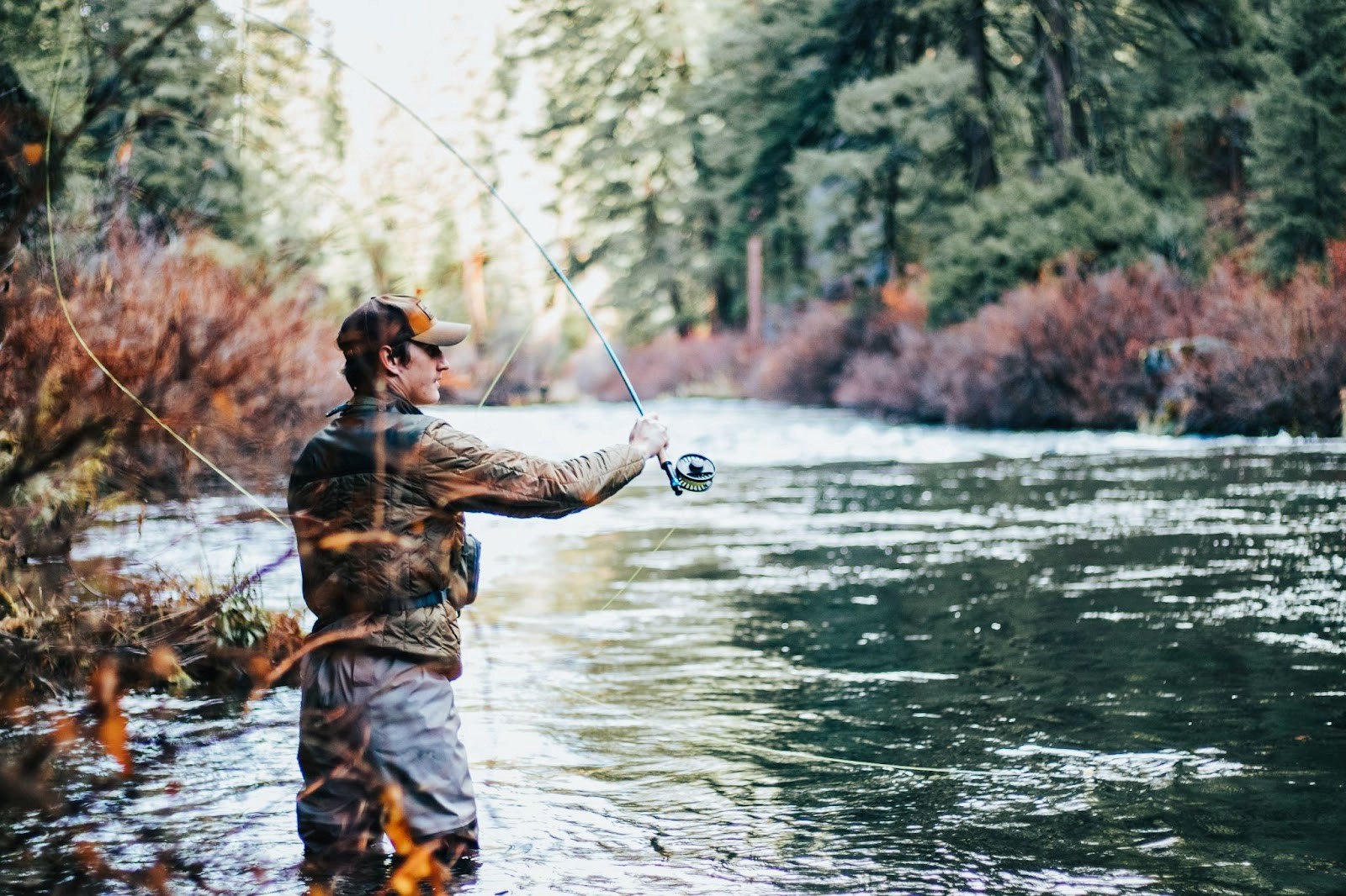 man fishing at lake