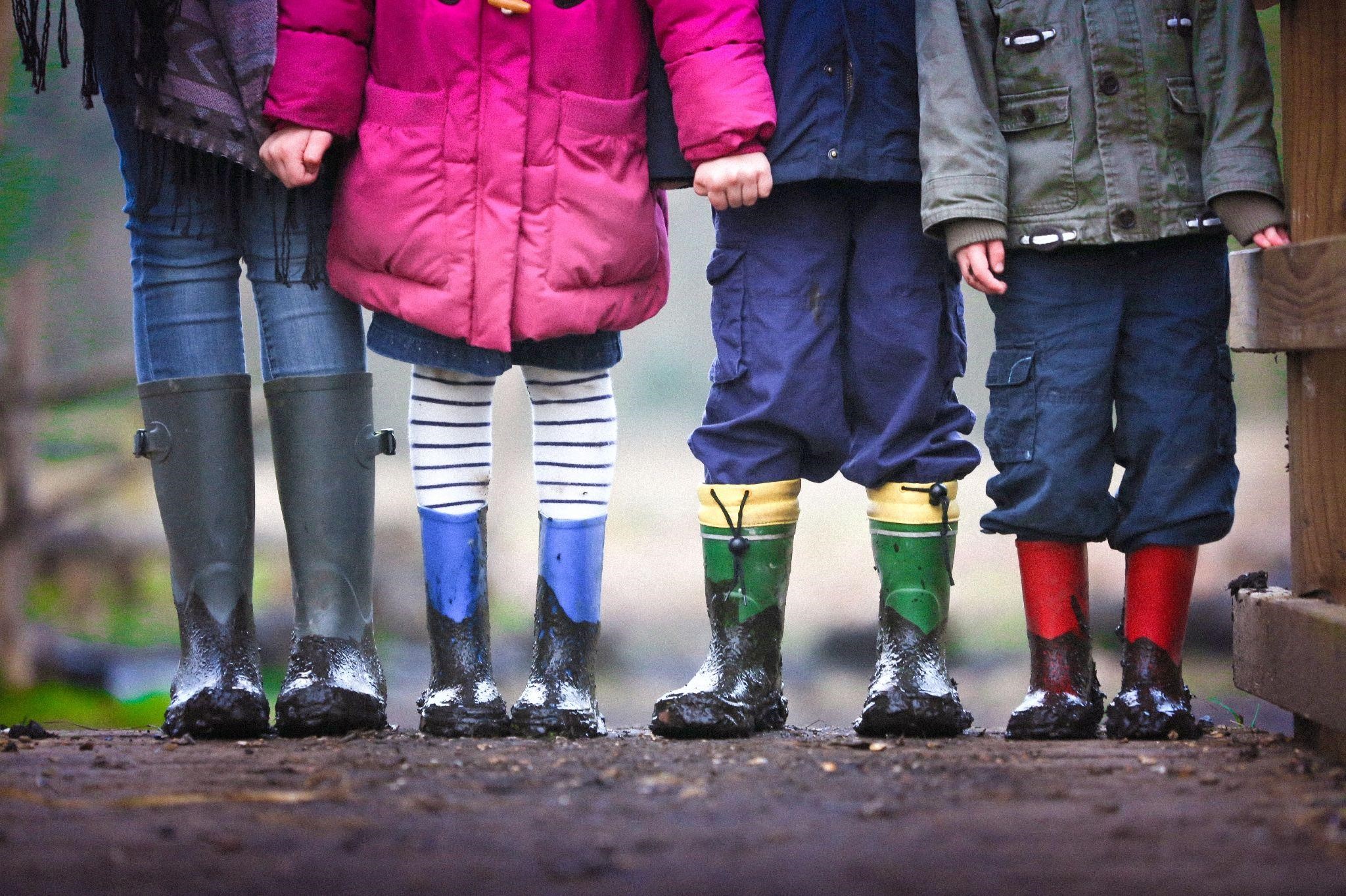 Children dressed for rainy weather