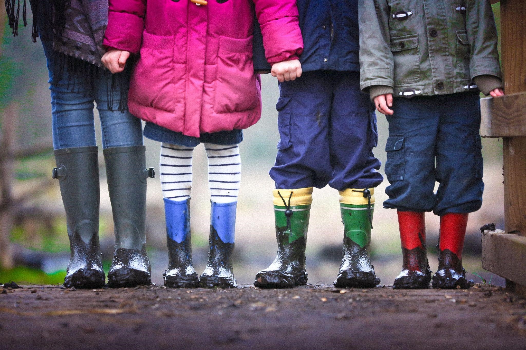 Children dressed for rainy weather