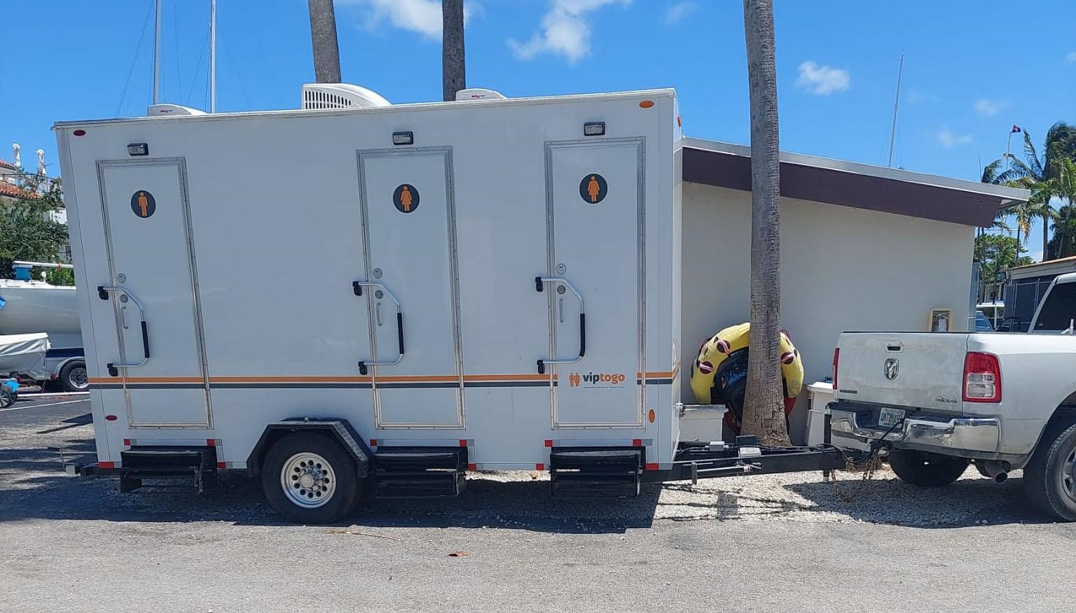 restroom trailer attached to delivery truck