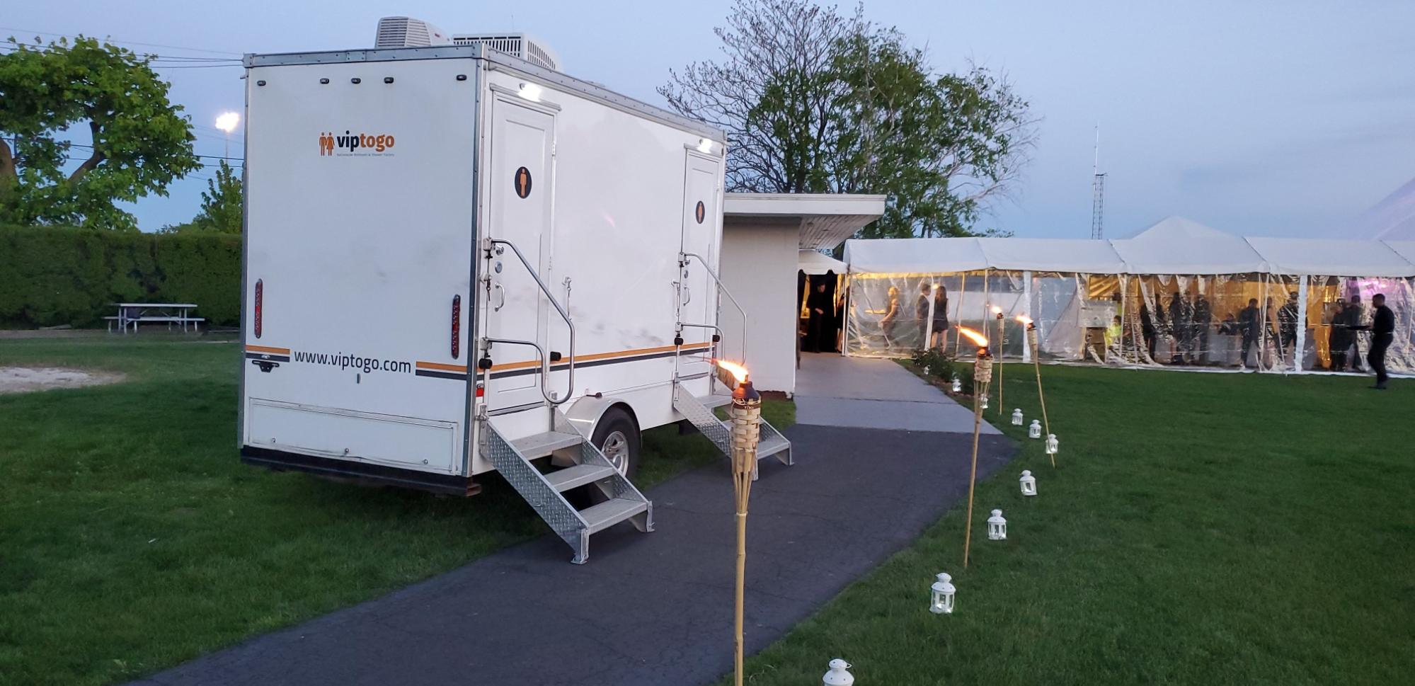 portable bathroom trailer at outdoor event