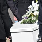 carrying coffin at funeral service