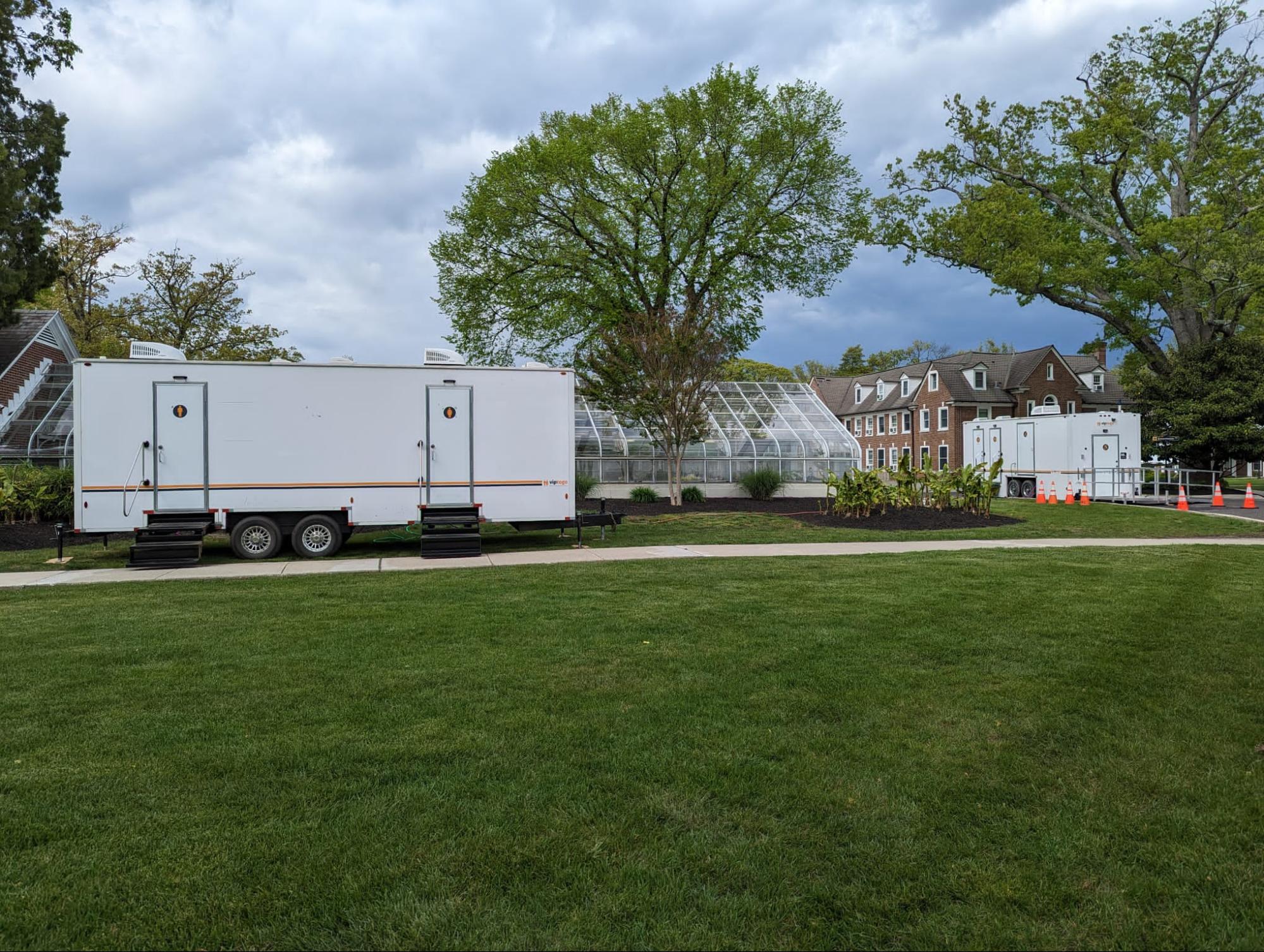 restroom trailers positioned at an outdoor event