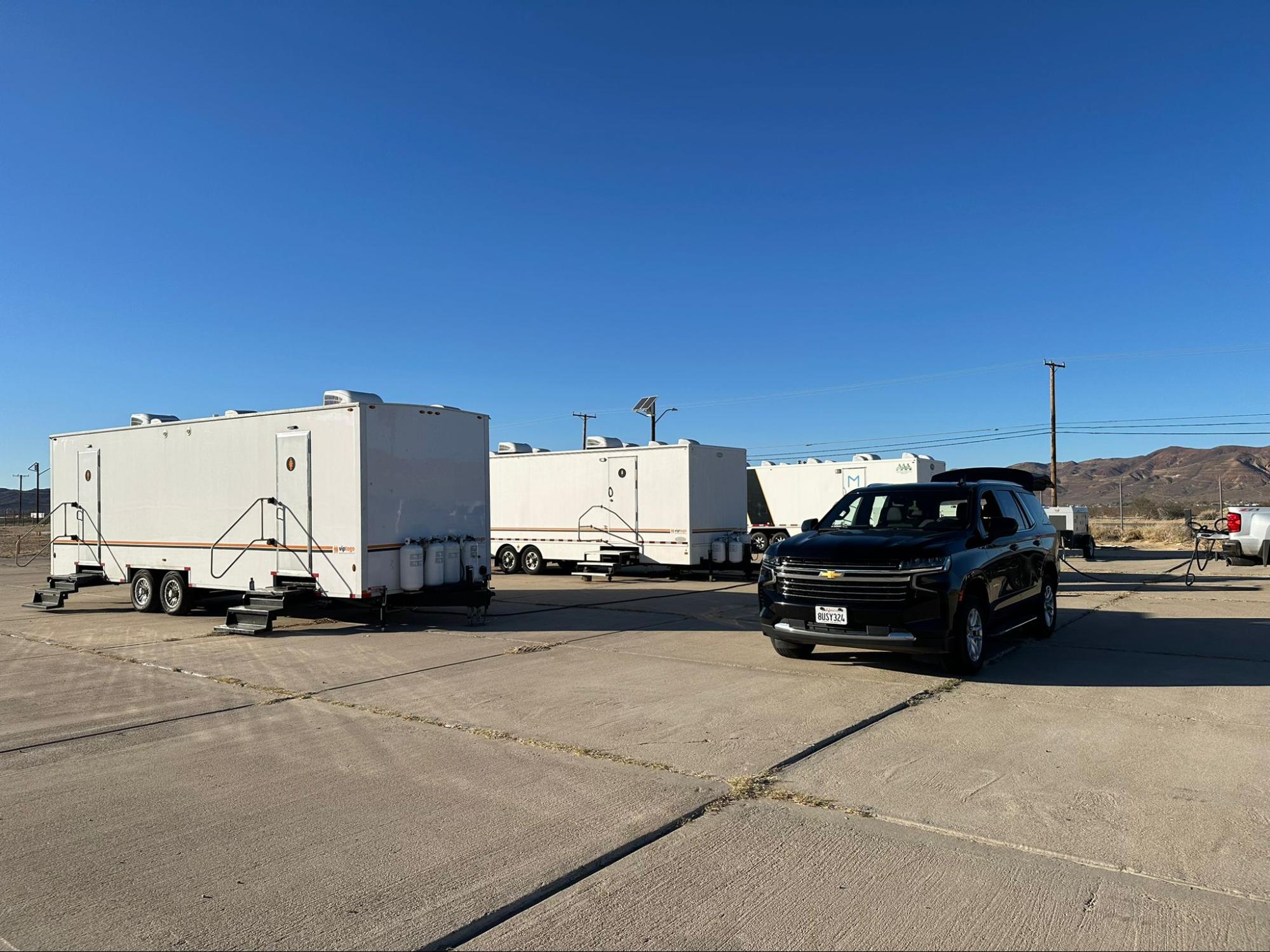 parking lot with restroom trailer rentals