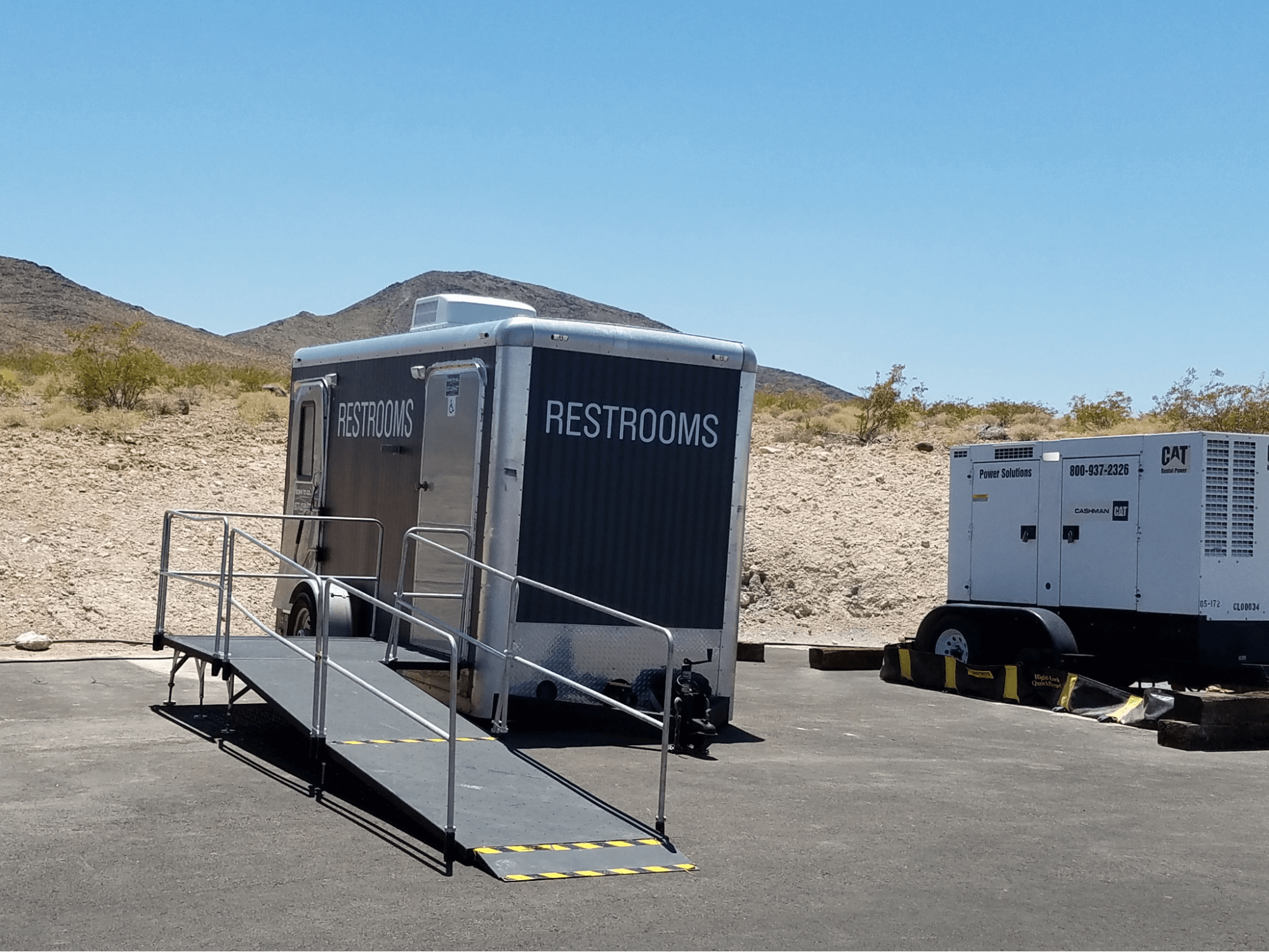ADA-compliant portable restroom trailer parked outdoors