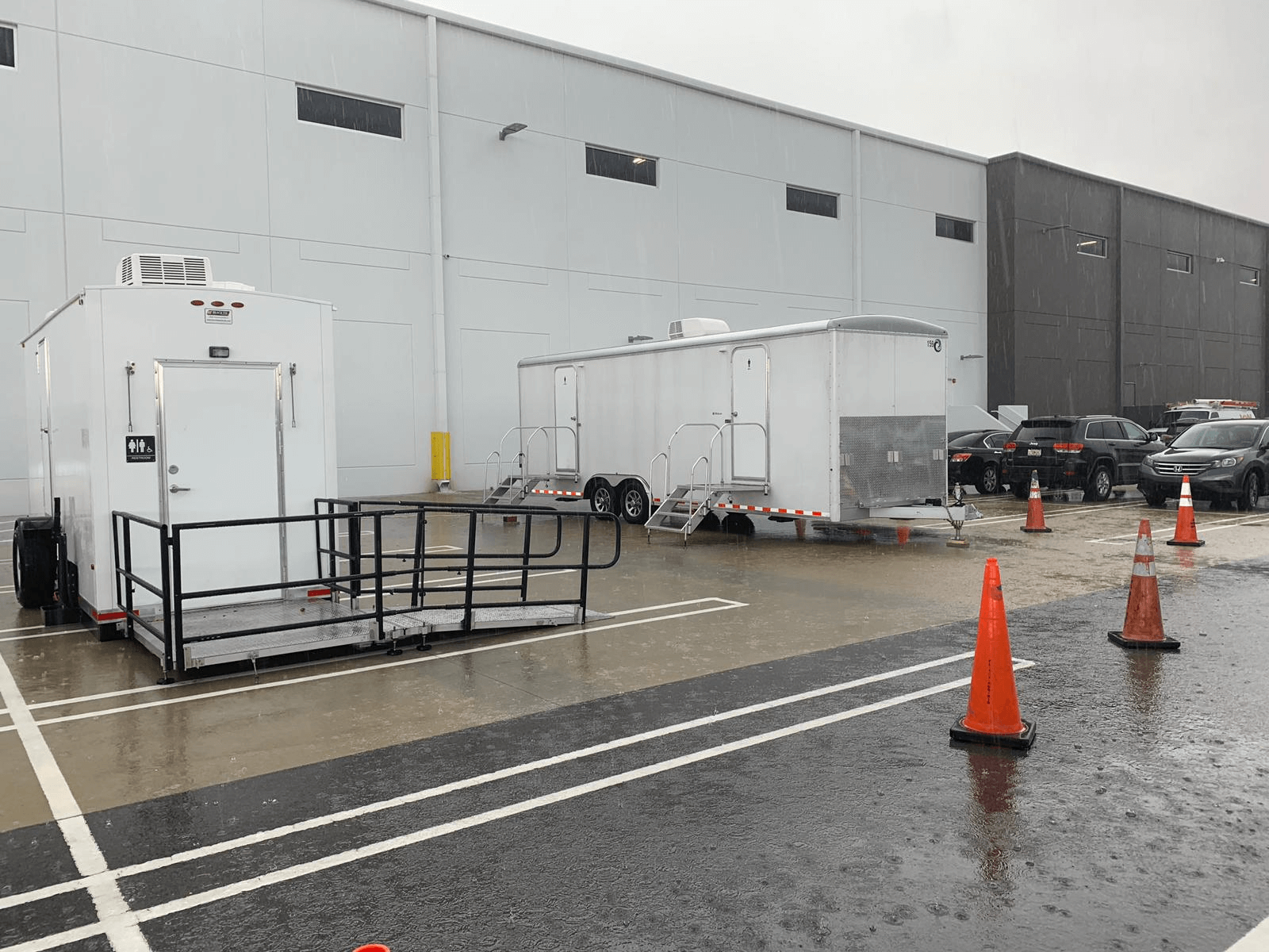 ADA-compliant restroom trailer parked at an outdoor event ADA-compliant restroom trailer parked at an outdoor event