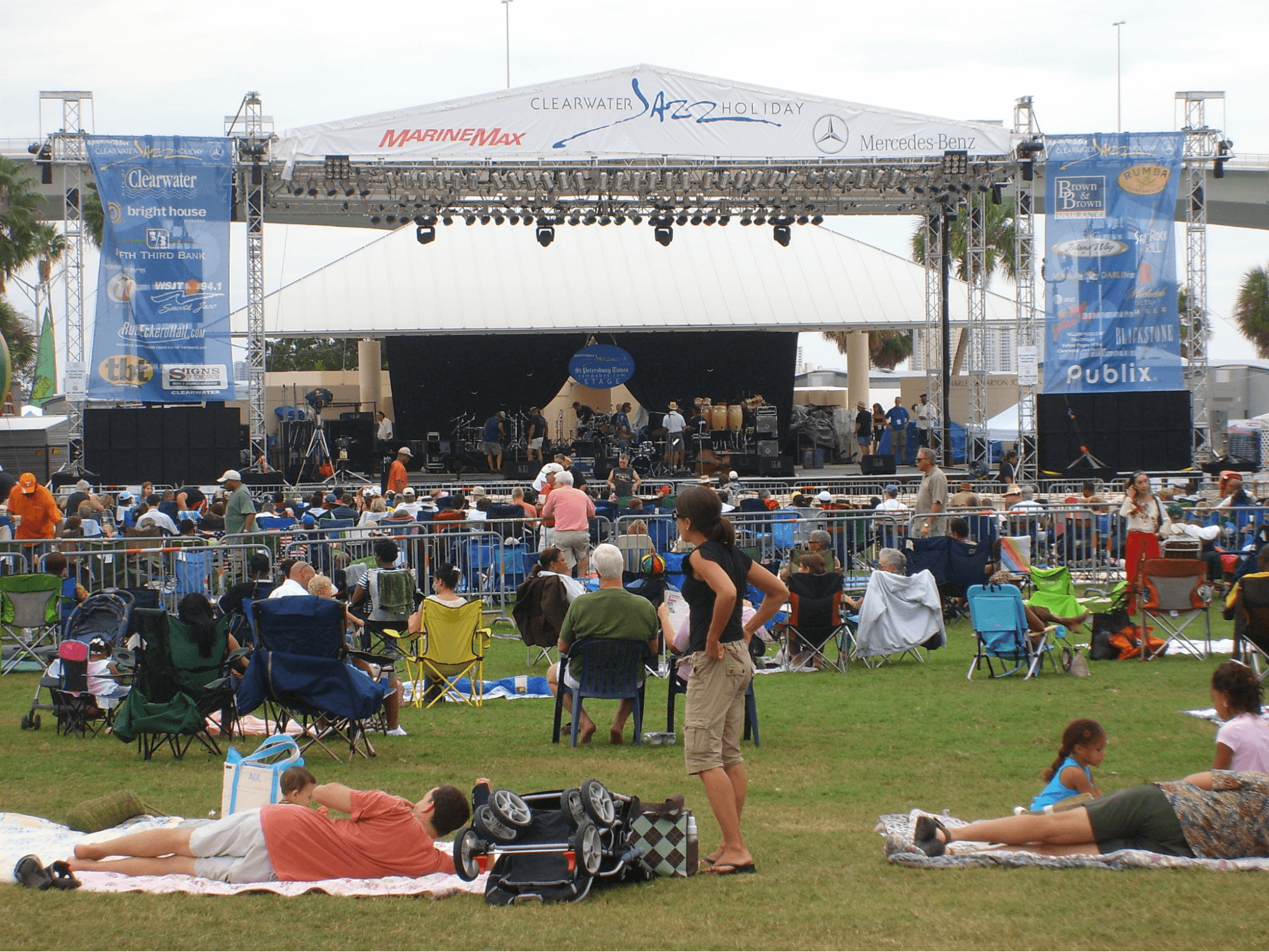 people gathered outdoors for a music concert