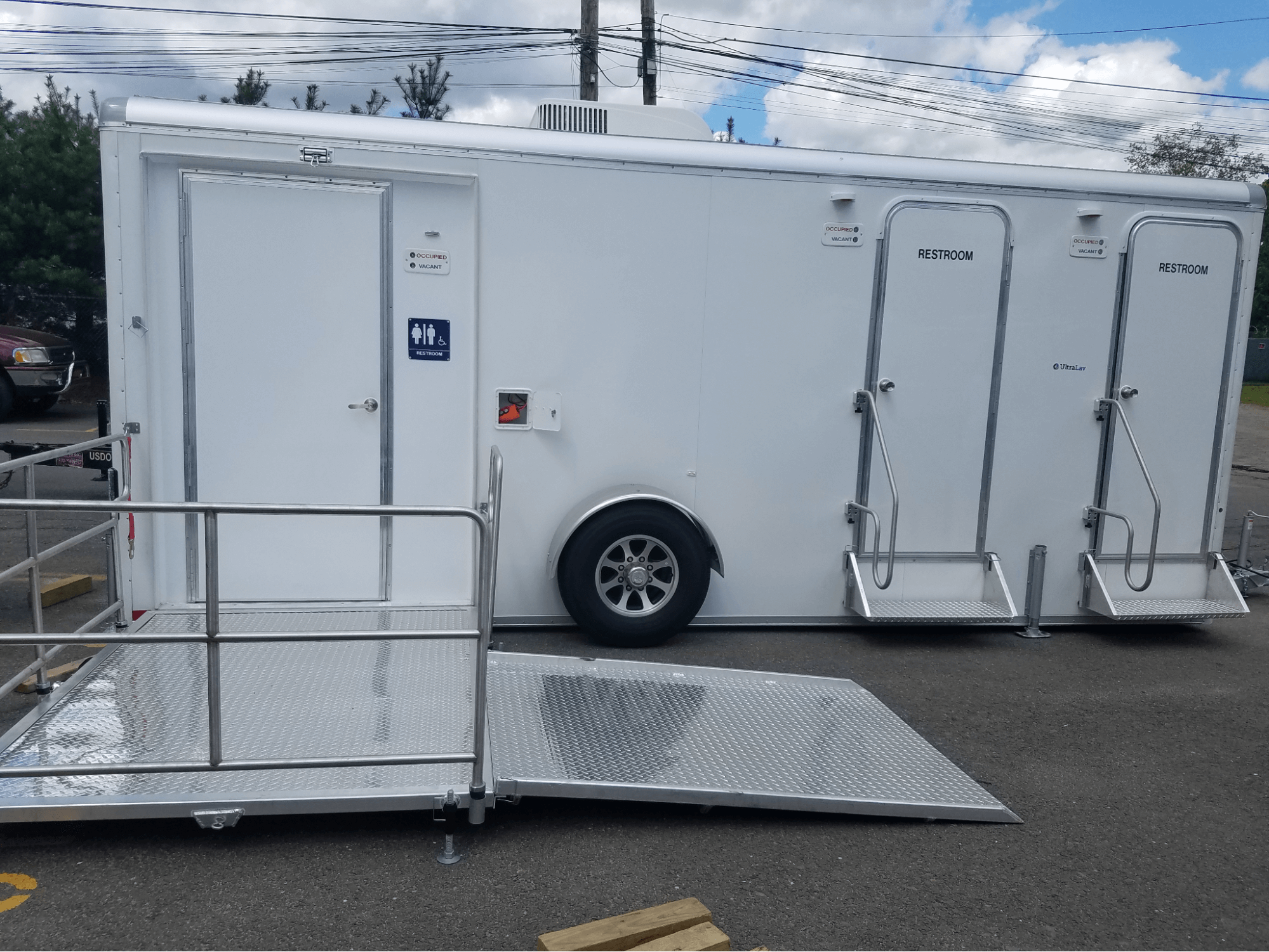 portable ADA-compliant restroom trailer with ramp for easy access portable ADA-compliant restroom trailer with ramp for easy access