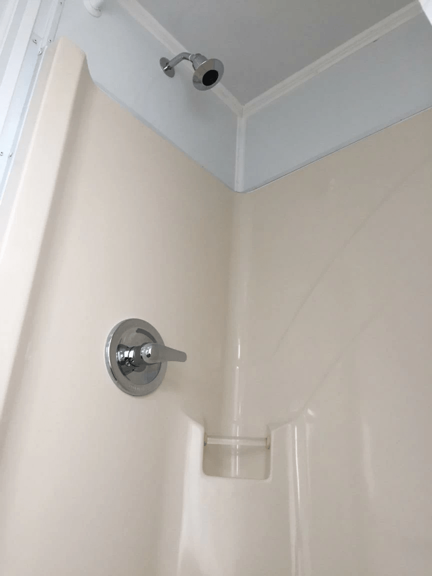 shower stall inside a portable restroom trailer