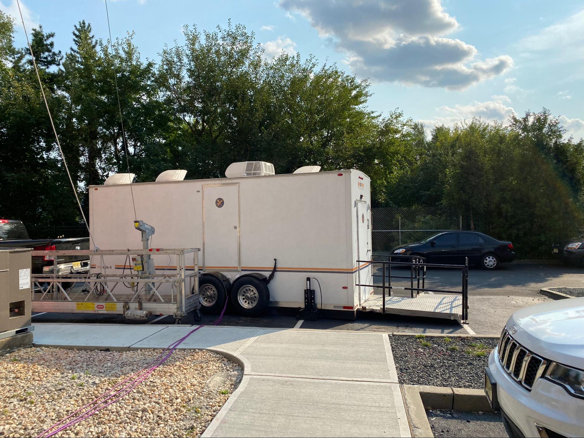 A portable handicap shower unit at an outdoor event A portable handicap shower unit at an outdoor event