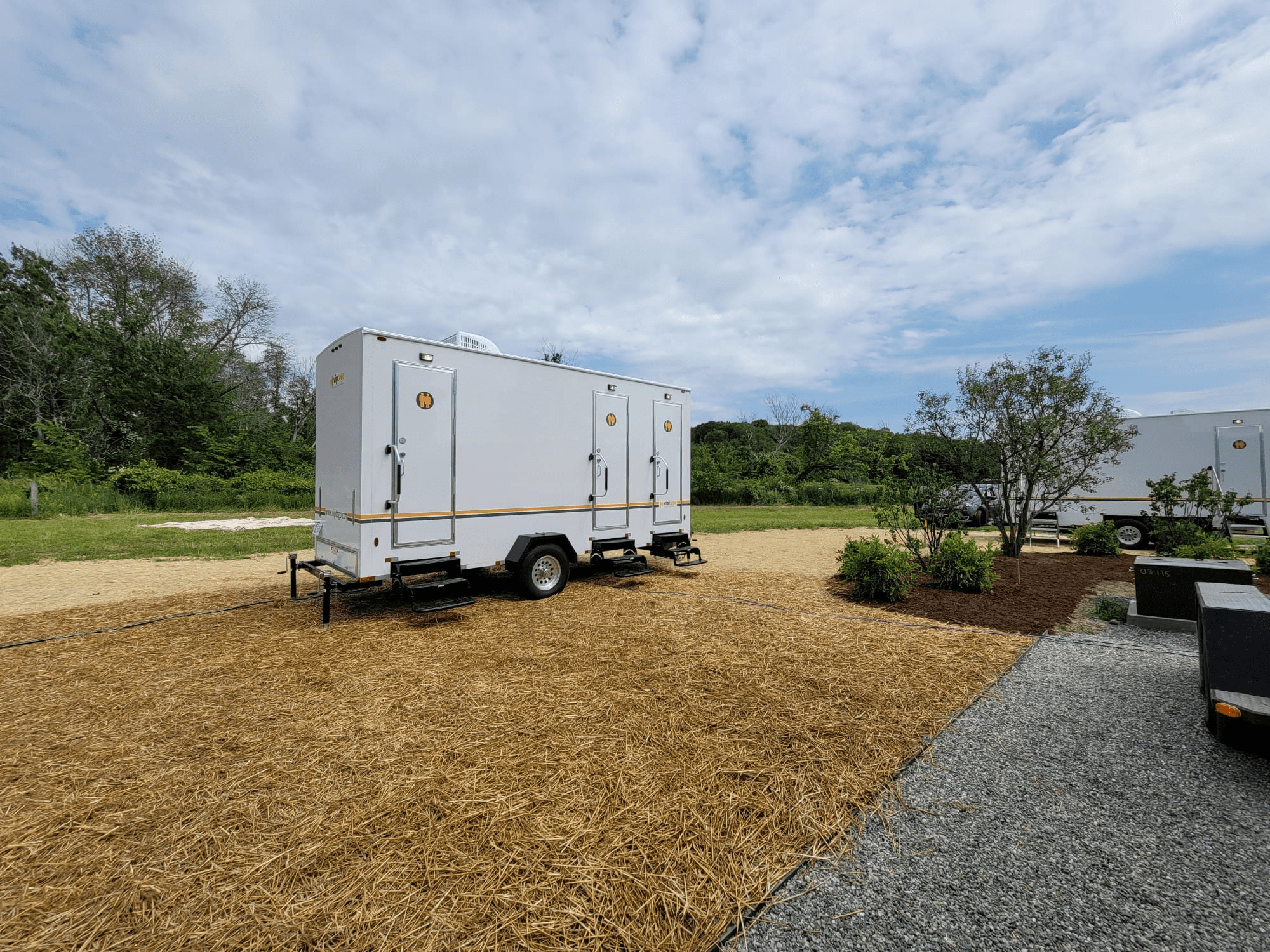 Restroom trailers positioned at an outdoor event