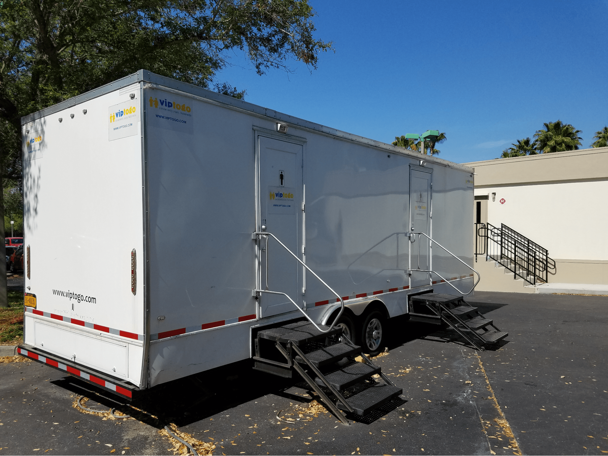 Luxury restroom trailer at an outdoor wedding