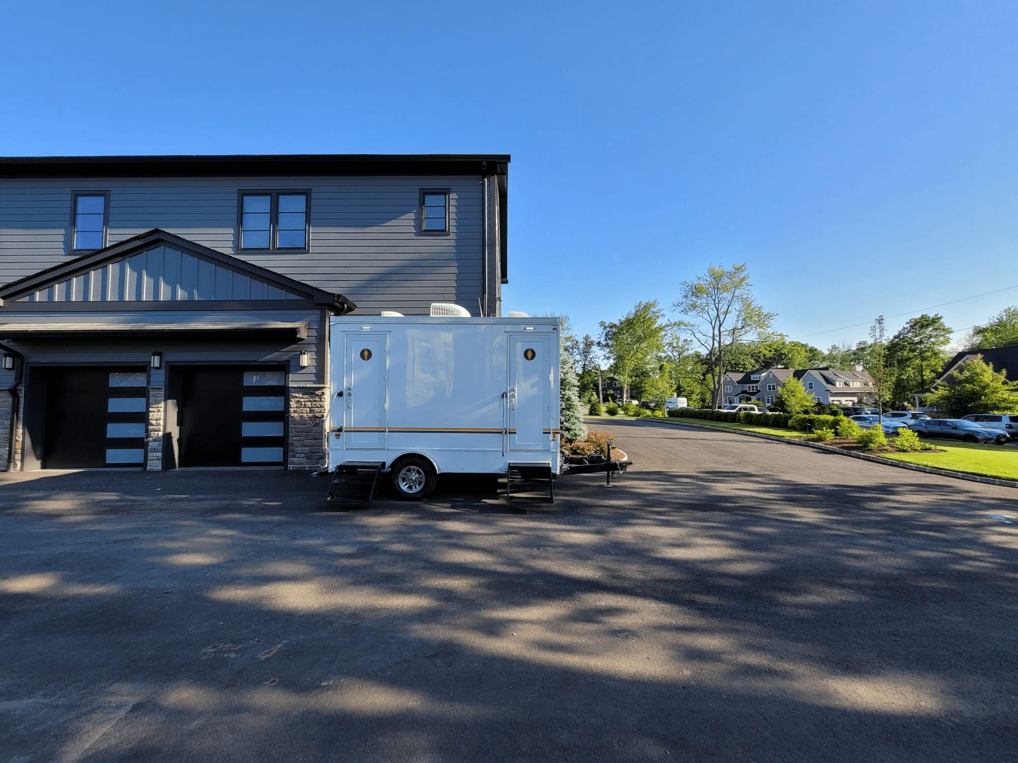 VIP To Go’s portable toilet trailer for outdoor weddings