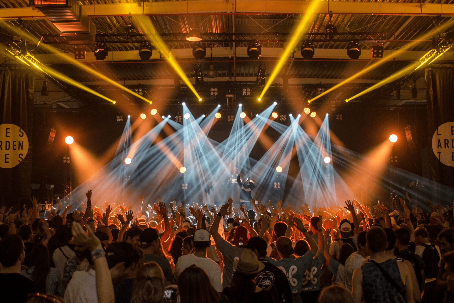 An outdoor music concert with a packed crowd