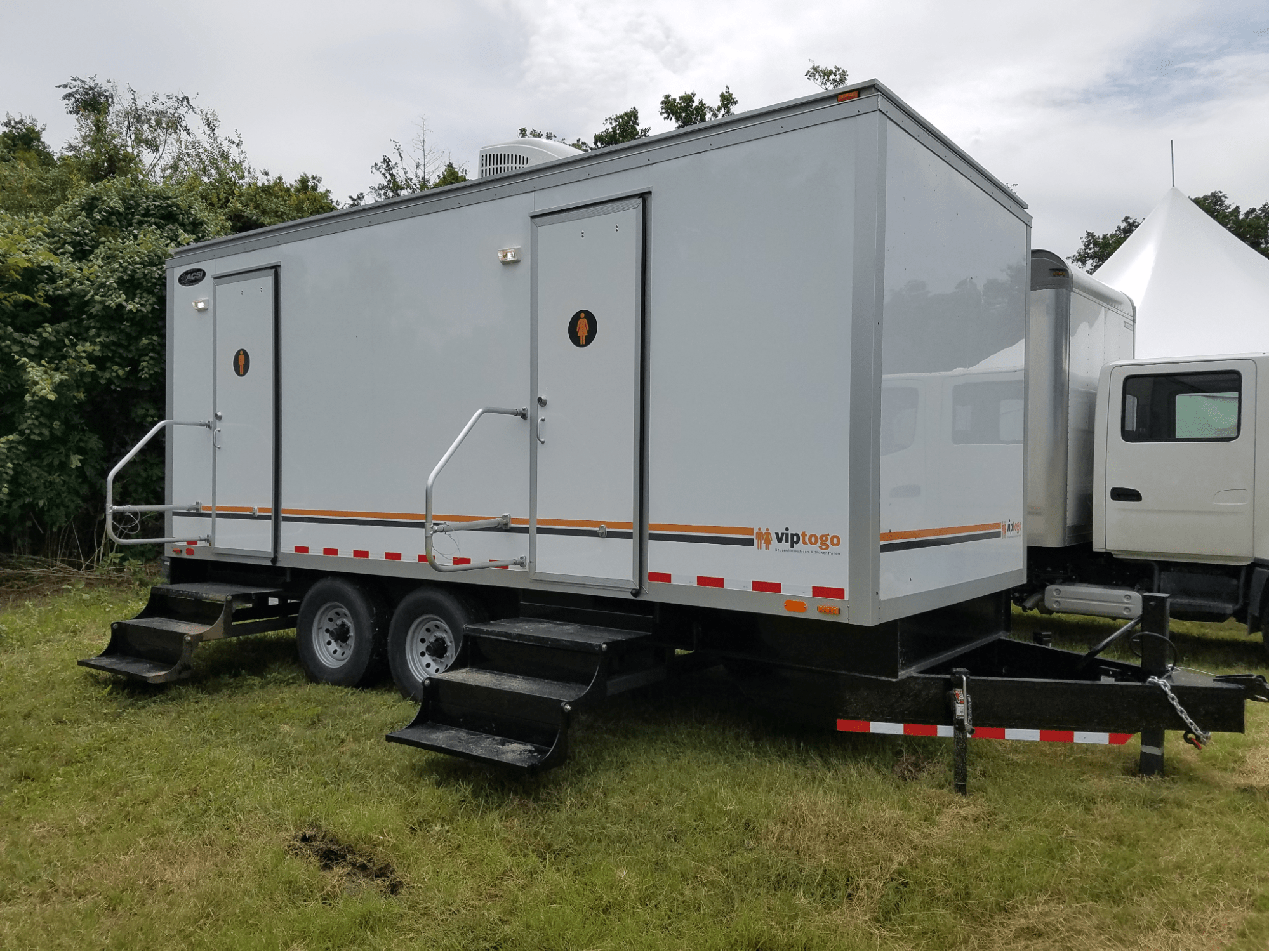 VIP To Go’s premium portable restroom trailer at an outdoor event