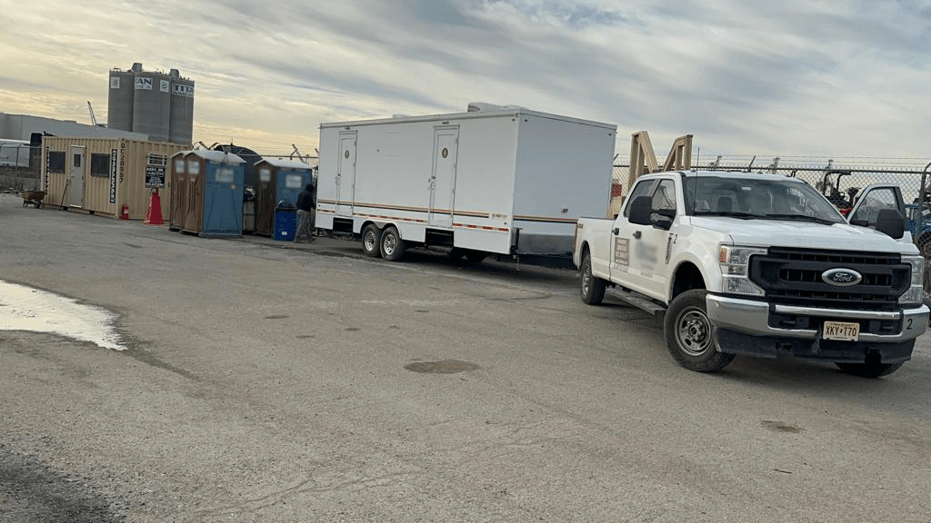 Large restroom trailer on construction site, Englewood, FL