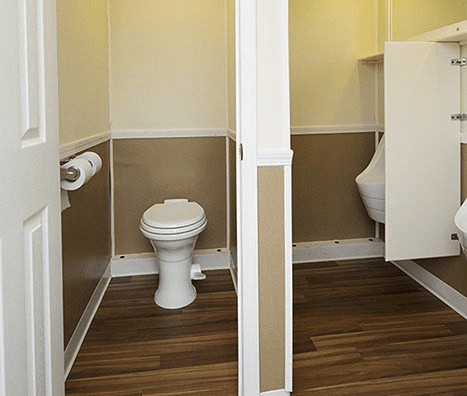 porta potty stalls inside restroom trailer for Queens, New York